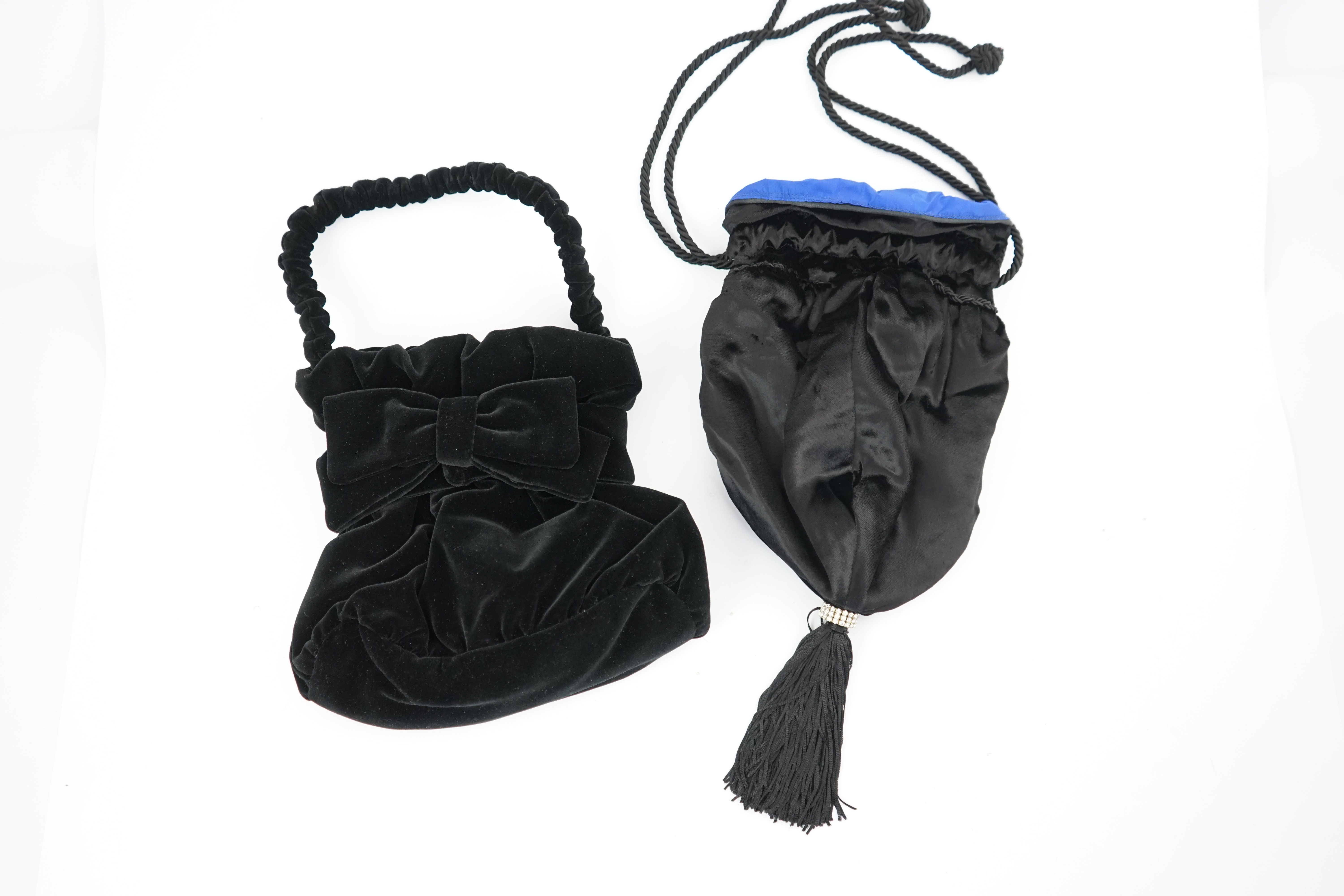 Two black velvet Italian evening bags, one labelled Rita Palmucci and the other Niro. One black silk velvet drawstring with blue satin lining, with tassel and diamanté decoration, the other black velvet with black satin